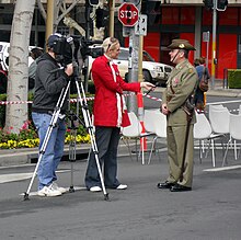 WIN News Riverina reporter, Erin Willing interviewing Major Jeff Cocks. WIN News camera man and Erin Willing interviewing.jpg
