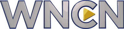 A silver lettering "WNCN" in a sans serif with blue edging. Lodged in the middle of the C is a triangle pointing forward.