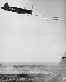 A Corsair fires its rockets at a Japanese stronghold on Okinawa