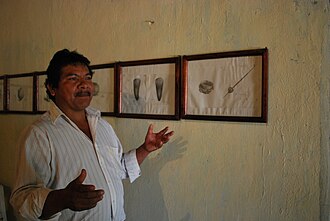 Ireneo Santa Ana Guerrero explaining images of textile weaving at the Amuzgo Community Museum XochistlahuacaCommMuseum02.JPG