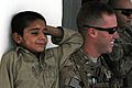 82nd Airborne Division medic interacts with Afghan child DVIDS483314.jpg