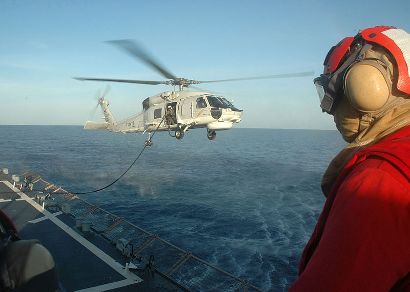 File:A U.S. Sailor with a crash and salvage crew aboard the guided missile destroyer USS Curtis Wilbur (DDG 54) in the Gulf of Thailand observes flight deck operations while a Thai Navy S-70B Seahawk helicopter 130608-N-AX577-336.jpg