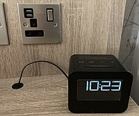 A digital alarm clock.