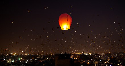 A night lit up on Makar Sankranti Uttarayana Festival with Kites and Lights.