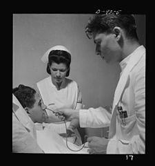 A student nurse aides the doctor in a gastric analysis 8b08211v.jpg