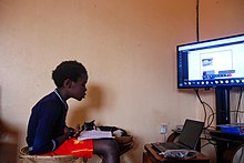 A young boy in Uganda studies at home during the COVID-19 Lockdown, June 2020 A young boy studies at home during the 2020 Covid 19 Lockdown.jpg