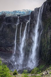 Glacier Castaño Overo spilling water and ice over the cliff on Cerro Tronador