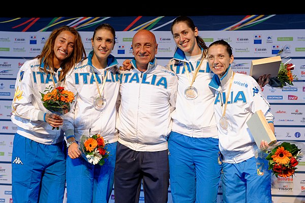 Di Francisca (L) with Team Italy and coach Andrea Cipressa on the podium of the 2014 European Championships