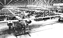1944 B-25 Mitchell assembly line in Air Force Plant NC: In 1953, the facility was the Buick-Oldsmobile-Pontiac Assembly Plant adjacent to Fairfax Field and unveiled the assembly line for F-84F Thunderflash
fighters (General Motors produced 599 F-84Fs at Fairfax.) B-25 Mitchell assembly line 1944.jpg