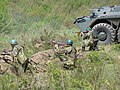 Romanian troops next to a TAB-77 APC during a military exercise of the 191th Infantry Battalion.