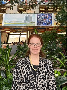 Bonnie Fleming photo in Fermilab atrium.jpg