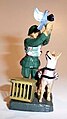 Toy soldier with dog, pigeon cage and pigeon with camera