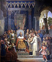 Charlemagne, entouré de ses principaux officiers, reçoit Alcuin qui lui présente des manuscrits réalisés par ses moines. Jean-Victor Schnetz, 1830, musée du Louvre, Paris.
