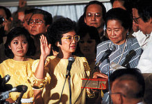 Corazon Aquino, widow of the assassinated opposition leader Benigno Aquino Jr., takes the Oath of Office on February 25, 1986. Corazon Aquino inauguration.jpg