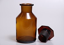 A dark glass bottle with ground glass plug. Dark bottle with ground glass plug.jpg