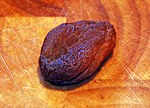 Dried apricot, with dark colour due to absence of sulfur dioxide treatment