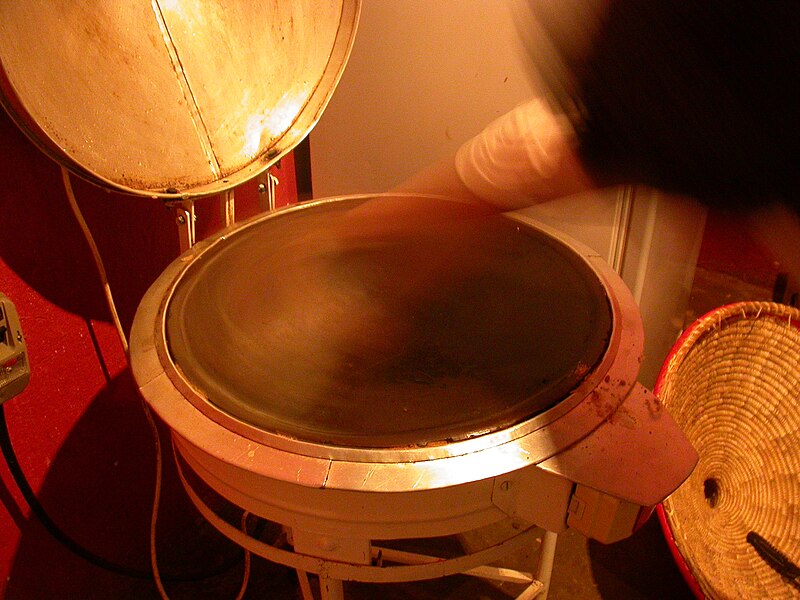 File:First step on making the injera, cleaning the stove.JPG