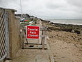 A section of the Isle of Wight Coastal Path closed off along the beach at Gurnard, Isle of Wight in October 2011. Several signs had been put up around the area to inform walkers of the closure.