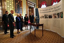 Presentation of a book of the Six Decades of H.M. The Queen's Commonwealth and State Visits, 18 December 2012 H.M. The Queen's Commonwealth and State Visits (8284359800).jpg