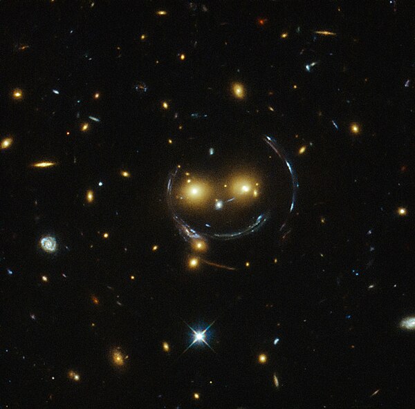 10 February: "Smiley" image of galaxy cluster (SDSS J1038+4849) and gravitational lensing (an Einstein ring) (HST).