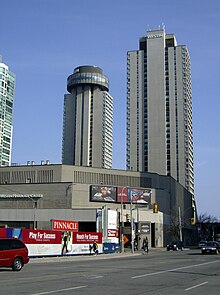 The two towers of the hotel, from the rear, with the hotel's convention centre building in foreground HarbourCastlebust.jpg