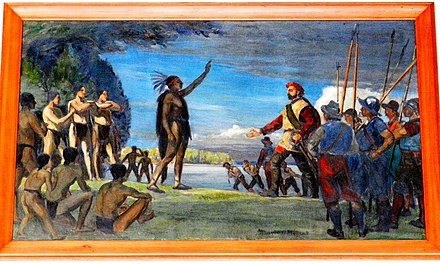 Painting by Adrien Hébert representing Jacques Cartier meeting the Iroquois.   The Iroquois chief raises his arm as a sign of welcome, while Cartier responds by raising his own slightly while keeping the other hand on his sword.