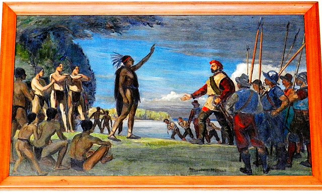 Painting by Adrien Hébert representing Jacques Cartier meeting the Iroquois. The Iroquois chief raises his arm as a sign of welcome, while Cartier res