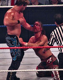 Jericho attacking the injured eye of Michaels at the 2008 The Great American Bash. Their rivalry was named "Feud of the Year" by both Pro Wrestling Illustrated and the Wrestling Observer Newsletter. Jericho y Michaels GAB.jpg