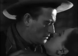 John Wayne and Ella Raines