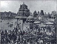 people taking holy dip in a temple tank