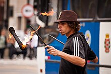 A performer using devil sticks Malabarista de Rua.jpg