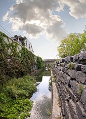 The "Mill Race," a 19th-century limestone canal to divert water from the Thames River to the mills Mill Race.jpg