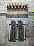 One of the windows, with wooden screens carved in arabesque openwork