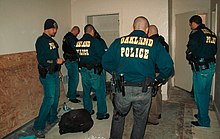 Members of the Oakland Police Department Gang Task Force with California Department of Corrections and Rehabilitation Special Service Unit agents in 2001 Oakland Police Gang Task Force.jpg