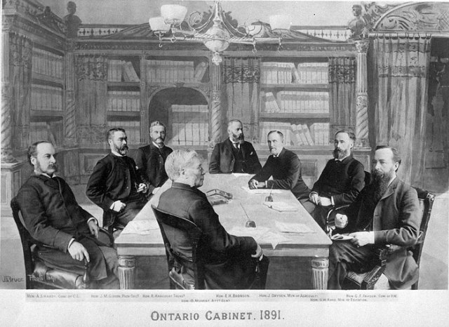 The Ontario Cabinet of 1891. Clockwise, starting at centre foreground: O. Mowat, A.S. Hardy, J.M. Gibson, R. Harcourt, E.H. Bronson, J. Dryden, G.W. R