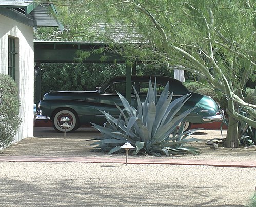 L. Ron Hubbard's car, a 1947 Buick Super 8. The car is parked behind the house.