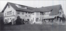 The front of the mock-Tudor-designed six-bedroom house, which contained a screening room, glassed-in sun porch, bowling alley and billiard room. Pickfair 1920.PNG