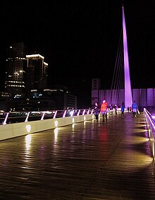 Crossing of the bridge at night. Puente de la Mujer (bridge) (5347777555).jpg