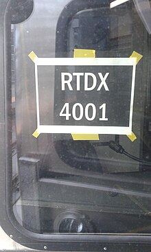 A temporary window sign with RTDX markings