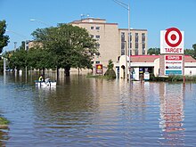 Residents boat through floodwaters of the Little Calumet in Munster in September 2008 Residents boat down a main street in Munster, IN.jpg