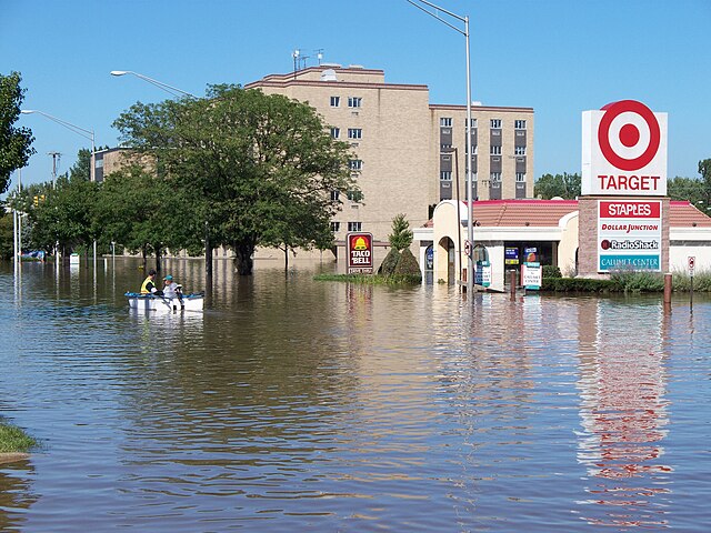 Residents boat through floodwaters of the Little Calumet in Munster in September 2008