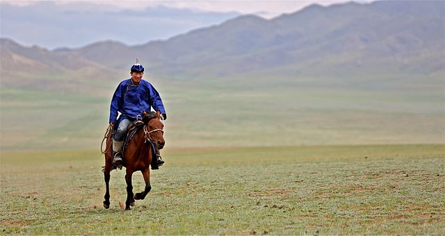 Rider in Mongolia, 2012. While nomadic life is less common in modern times, the horse remains a national symbol in Mongolia.