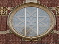 The rose window at the main entrance of Holy Rosary Church, located on the corner of Union Street and Essex Street in Lawrence, Massachusetts.