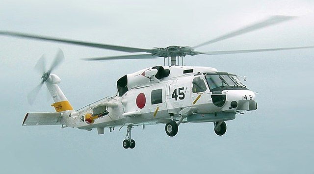 A JMSDF SH-60J Seahawk helicopter from JDS Haruna lands on board USS Russell in 2007.