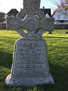 The headstone of Spike Milligan's grave in the grounds of St Thomas' Winchelsea, East Sussex. The name of his last wife was added along with birth and death dates and an additional epitaph. Spike Milligan's epitaph includes the phrase Dúirt mé leat go raibh mé breoite, Irish for I told you I was ill.[74] The headstone is positioned roughly midway between the New Inn and the church door.