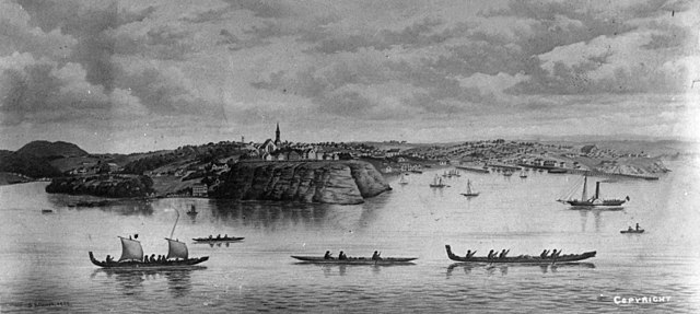 The Auckland waterfront with Māori waka and the original St Paul's Church building above Point Britomart, painted in 1852.