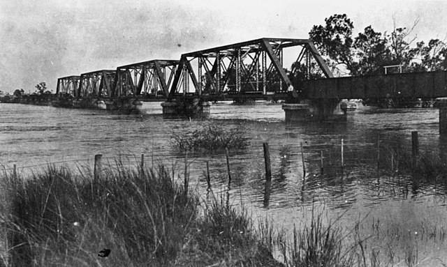 Railway bridge in Emerald during a flood, 1918