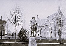 Statue of Benjamin Franklin, stood on west side of South State Street in front of University Hall Statue of Benjamin Franklin Standing on lawn in front of University Hall First Congregational Church and Union School West Hall visible across State Street.jpg