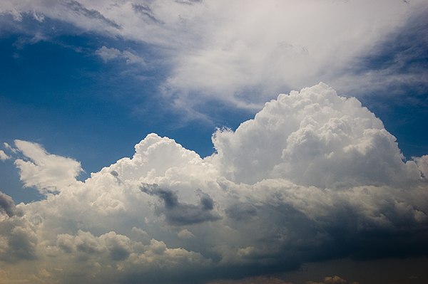 Cumulonimbus cloud surrounded by stratocumulus