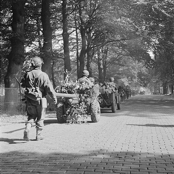 Soldiers of the 2nd Battalion, South Staffordshire Regiment, part of 1st Airlanding Brigade of 1st Airborne Division, marching on a road between Ooste